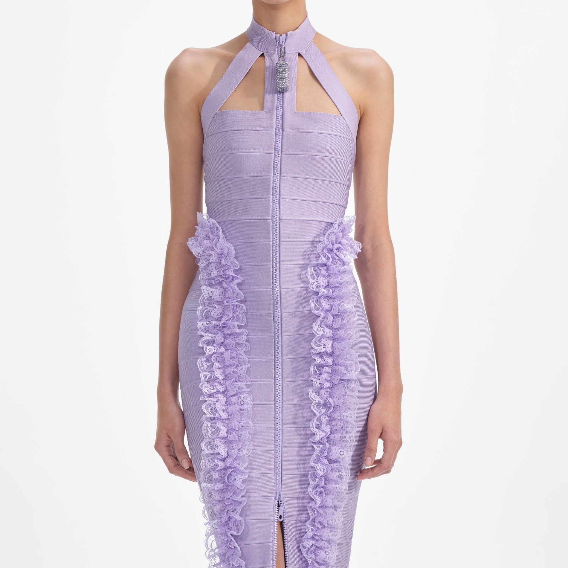 A close up of a woman wearing the Purple Knit Zip Ruffle Maxi Dress