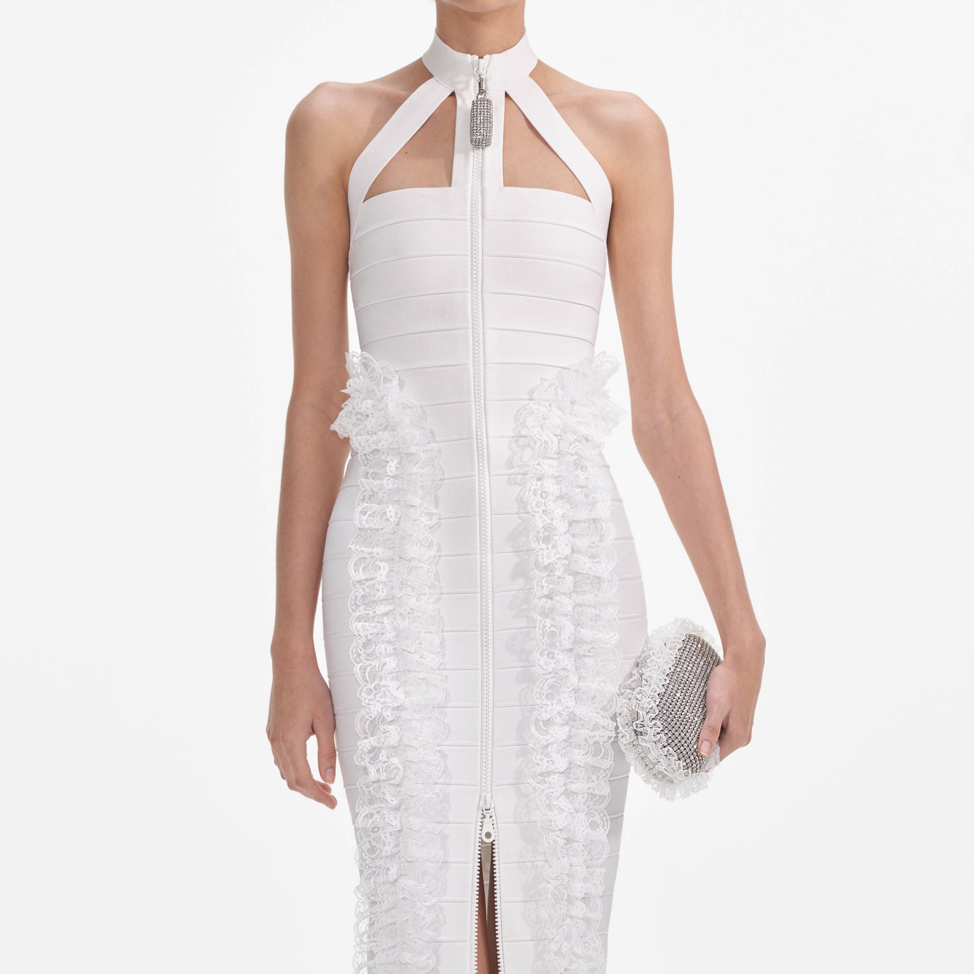 A close up of a woman wearing the White Knit Zip Ruffle Maxi Dress
