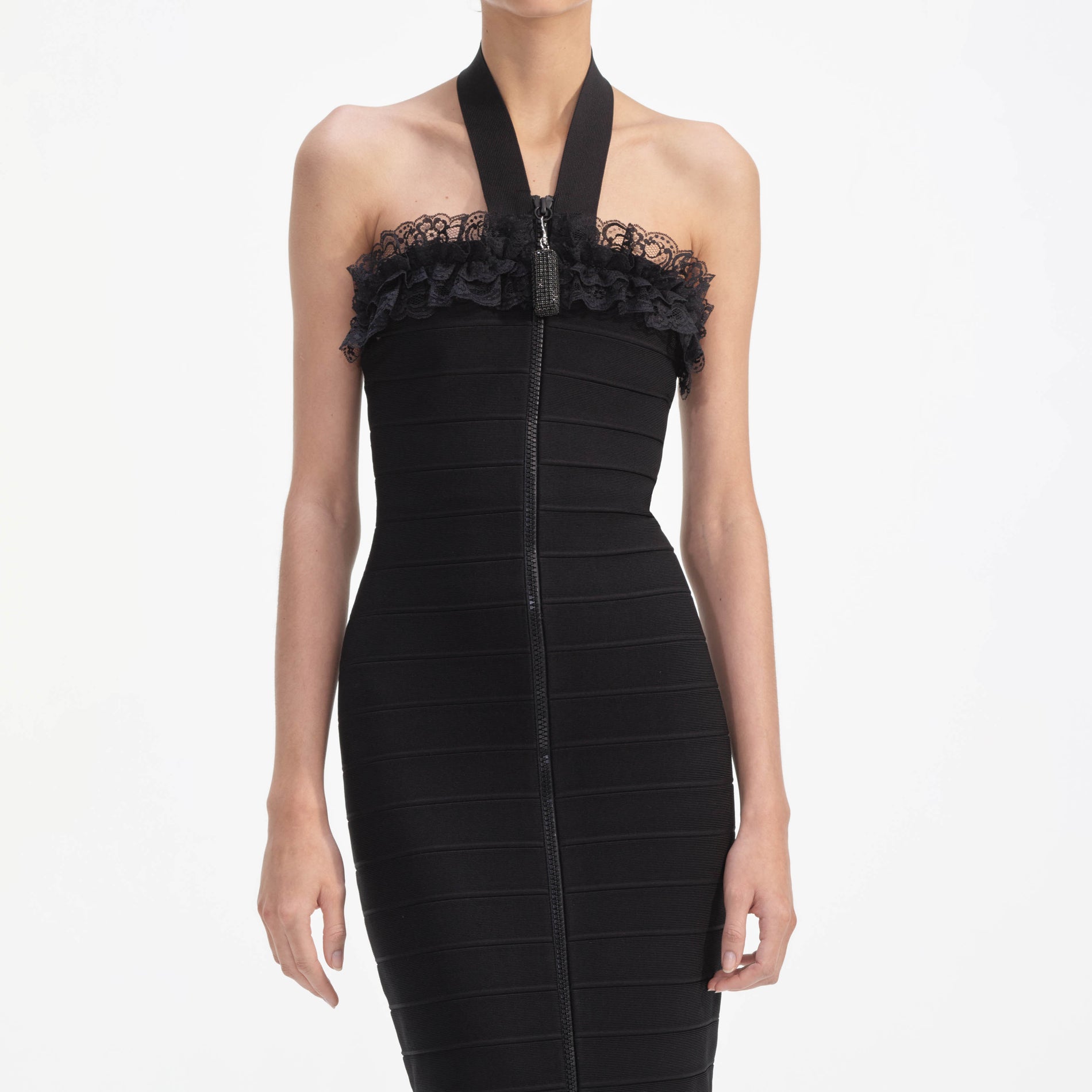 A close up of a woman wearing the Black Knit Zip Ruffle Midi Dress