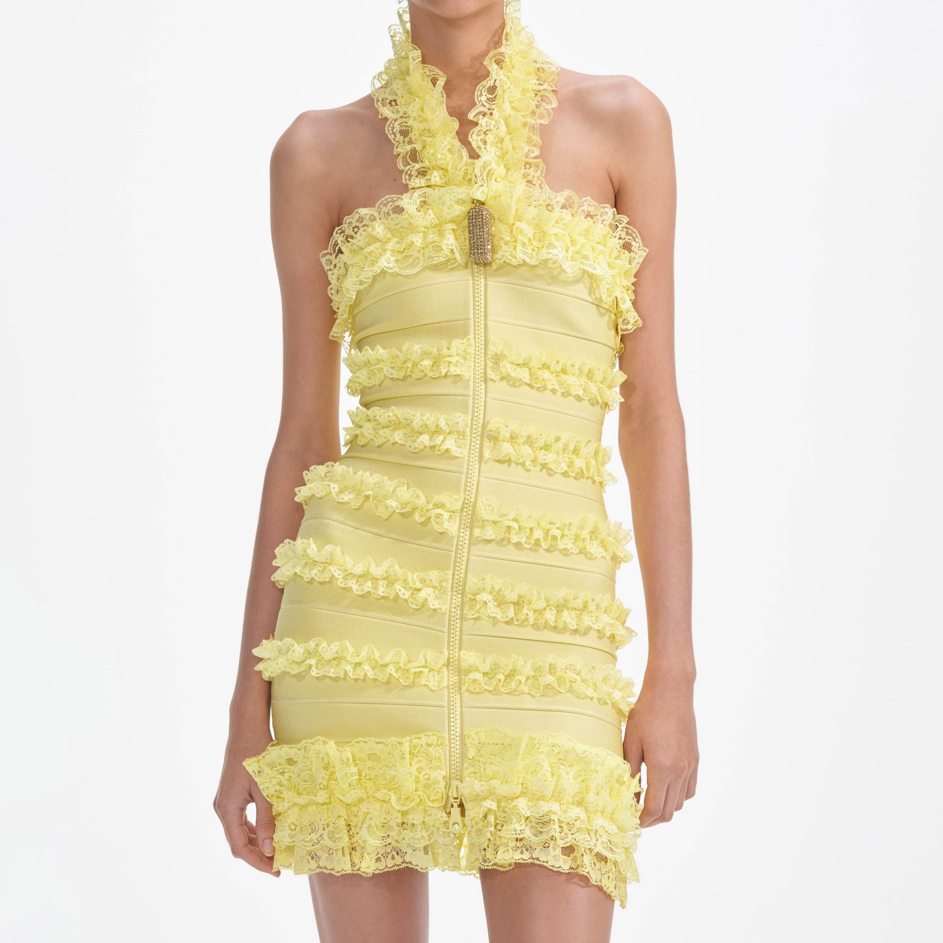 A close up of a woman wearing the Yellow Knit Zip Ruffle Mini Dress