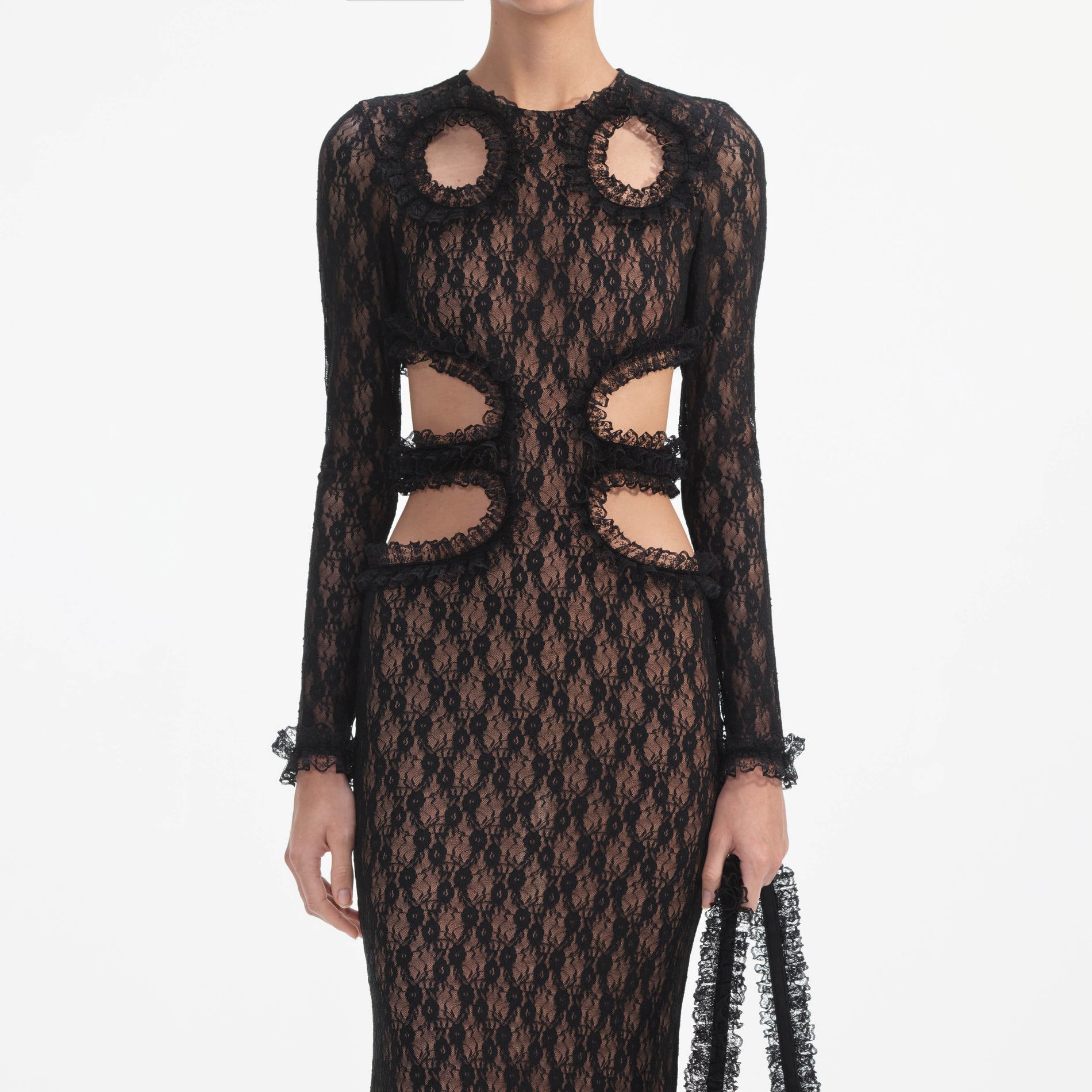 A close up of a woman wearing the Black Lace Cut Out Maxi Dress