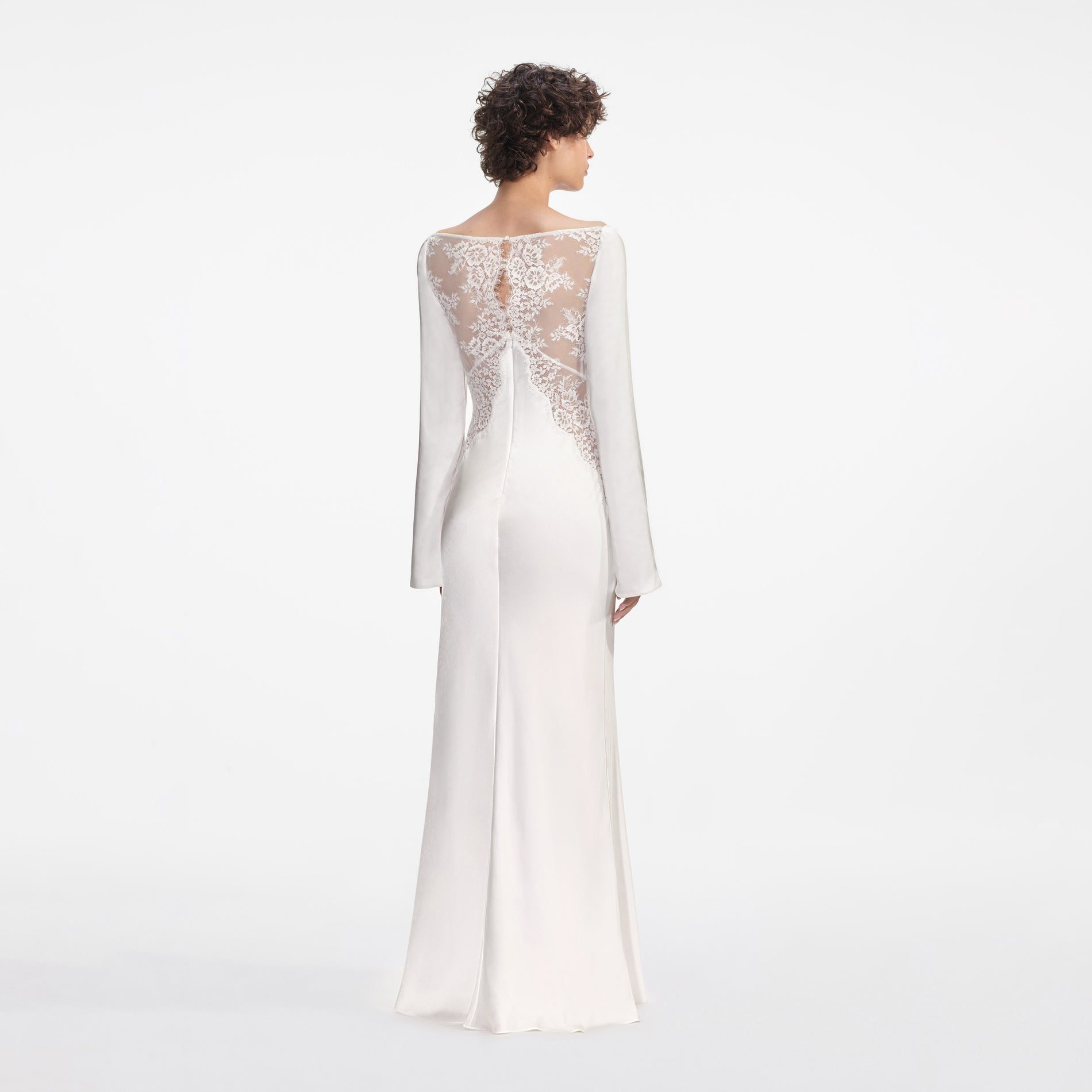 Back view of a woman wearing the White Lace Satin Long Sleeve Maxi Dress