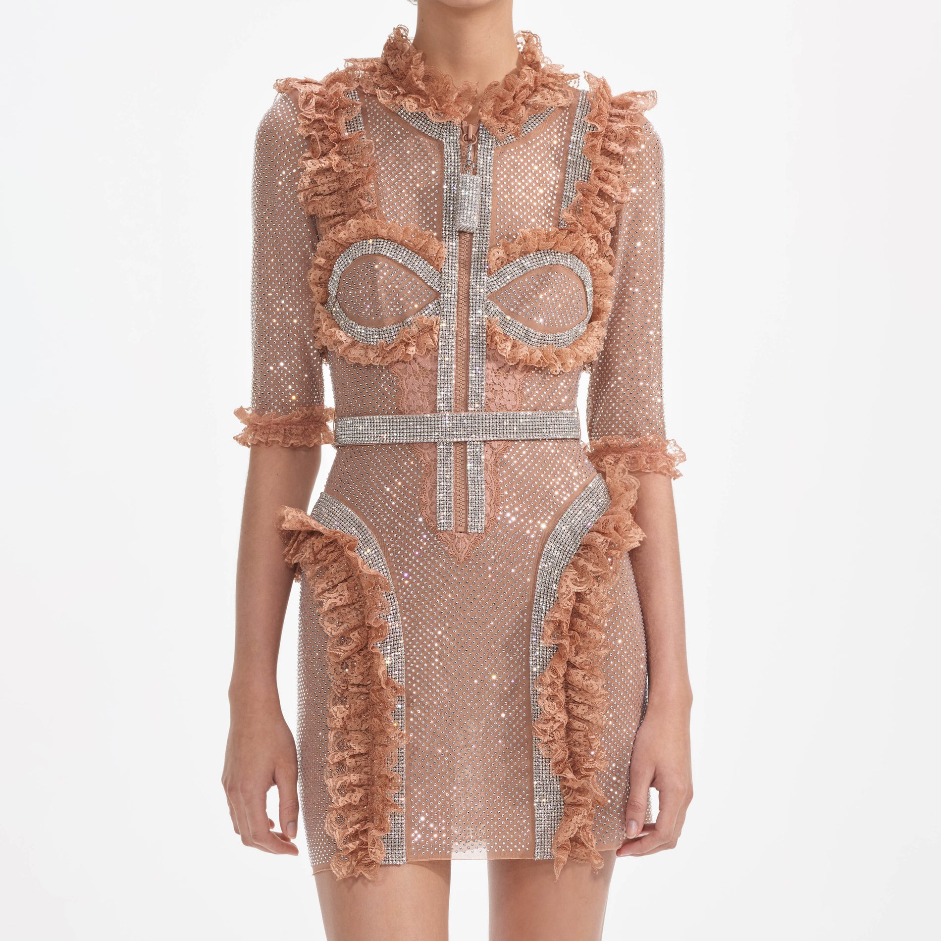 A close up of a woman wearing the Tan Rhinestone Mesh Ruffle Mini Dress