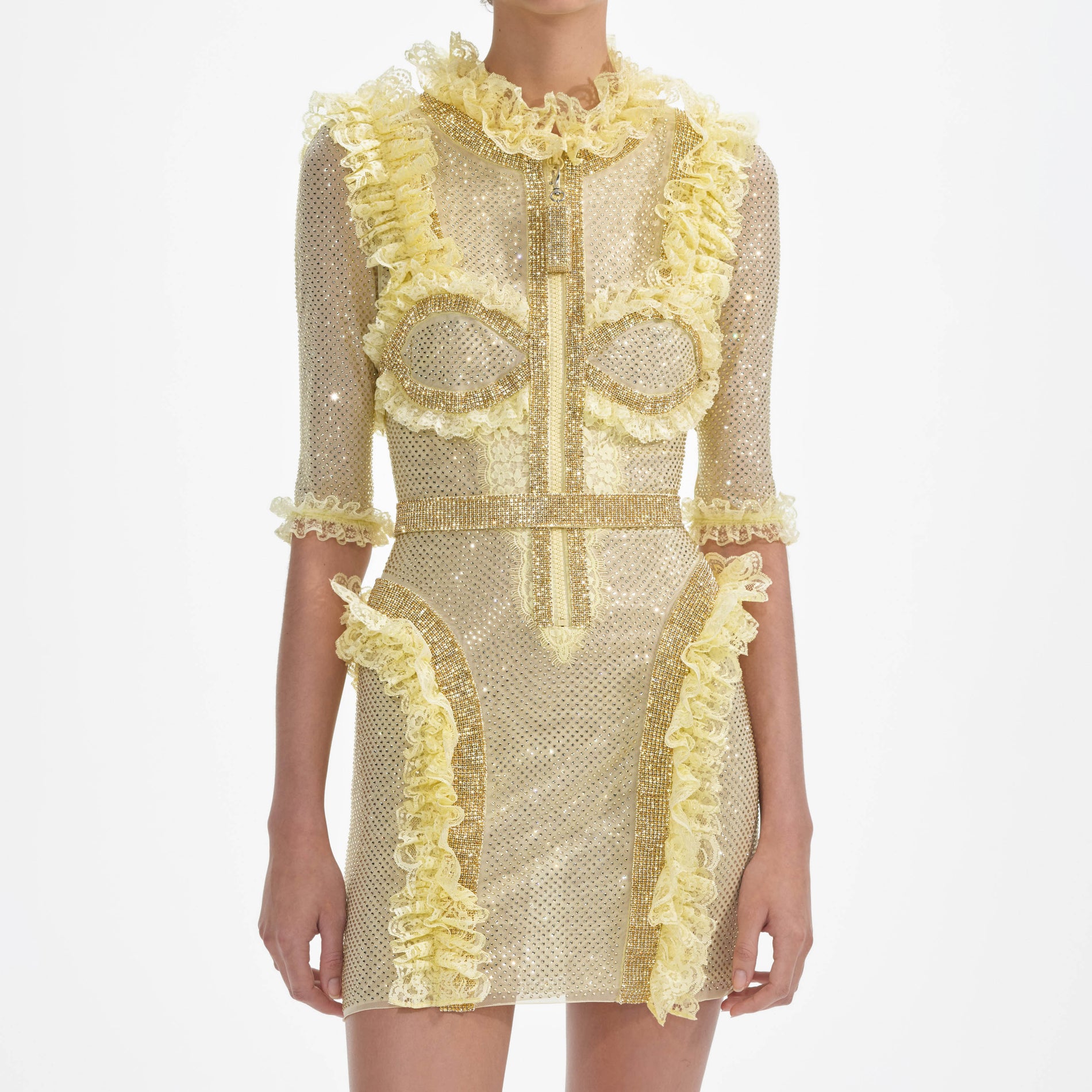 A close up of a woman wearing the Yellow Rhinestone Mesh Ruffle Mini Dress