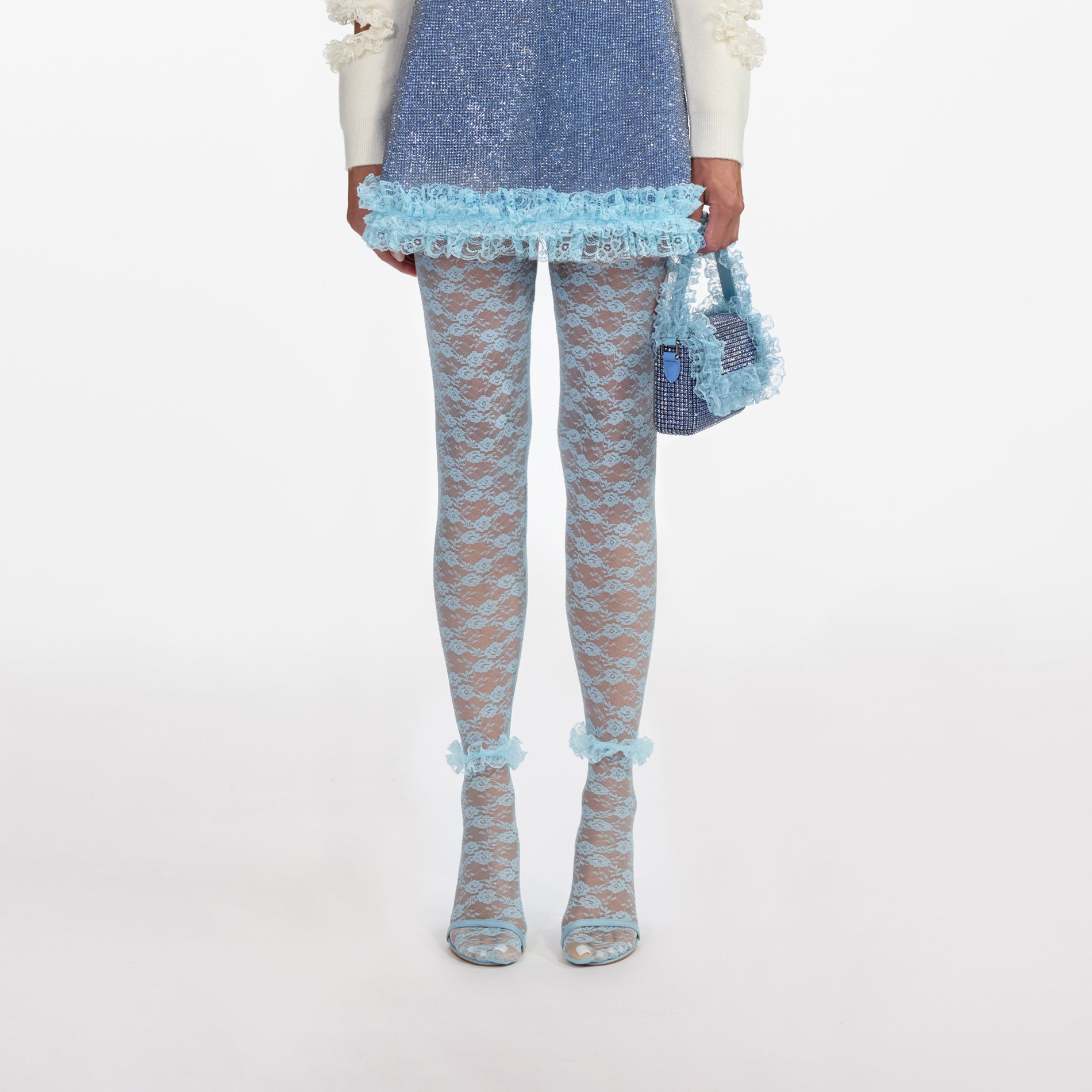 Front view of a woman wearing the Blue Lace Tights