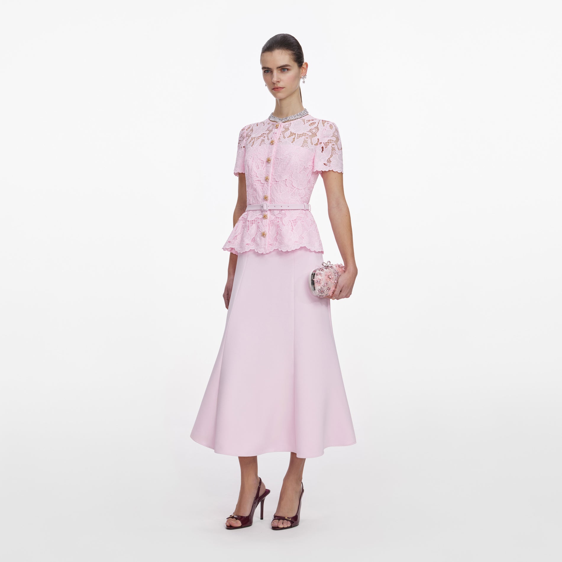 Side view of a woman wearing the Pink Lace Crepe Midi Dress