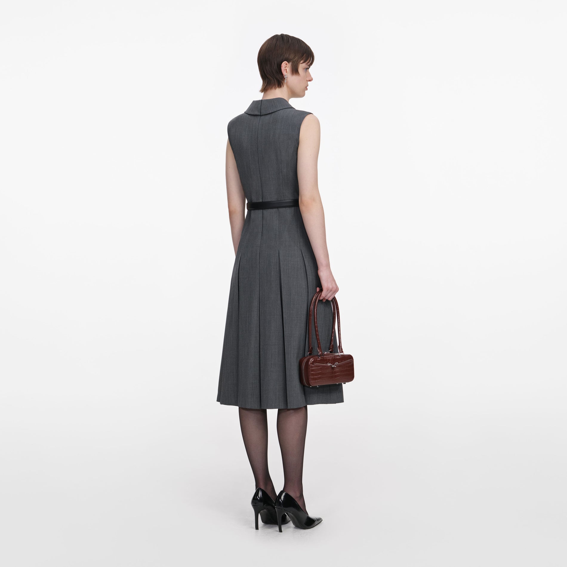 Back view of a woman wearing the Grey Tailored Pleated Midi Dress