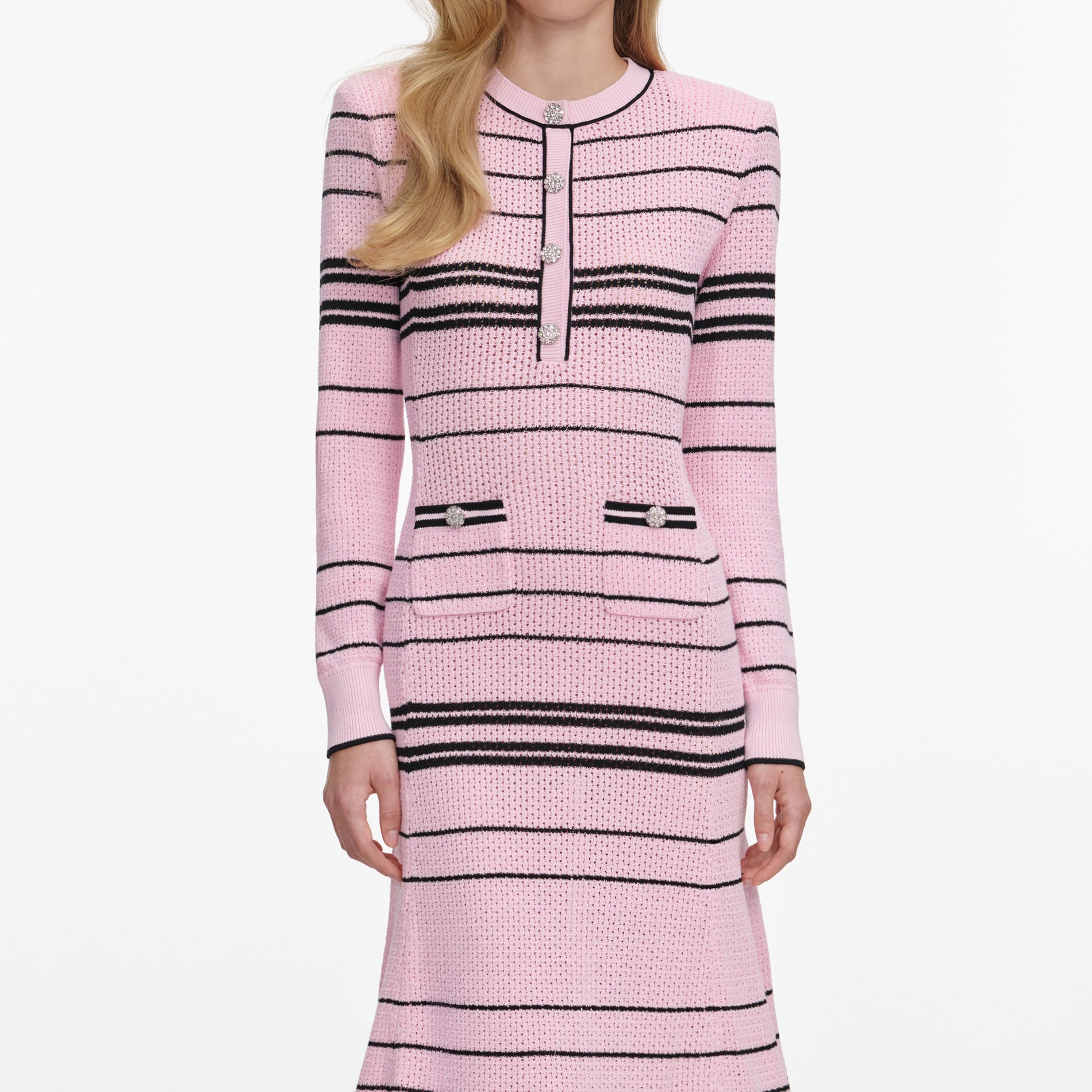 A close up of a woman wearing the Pink Stripe Knit Midi Dress