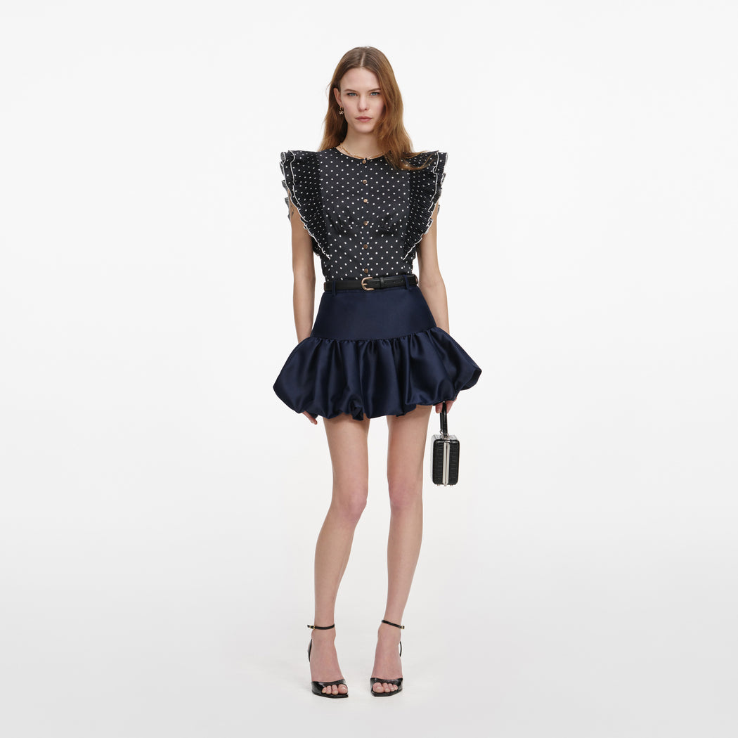 Front view of a woman wearing the Navy Taffeta Skirt