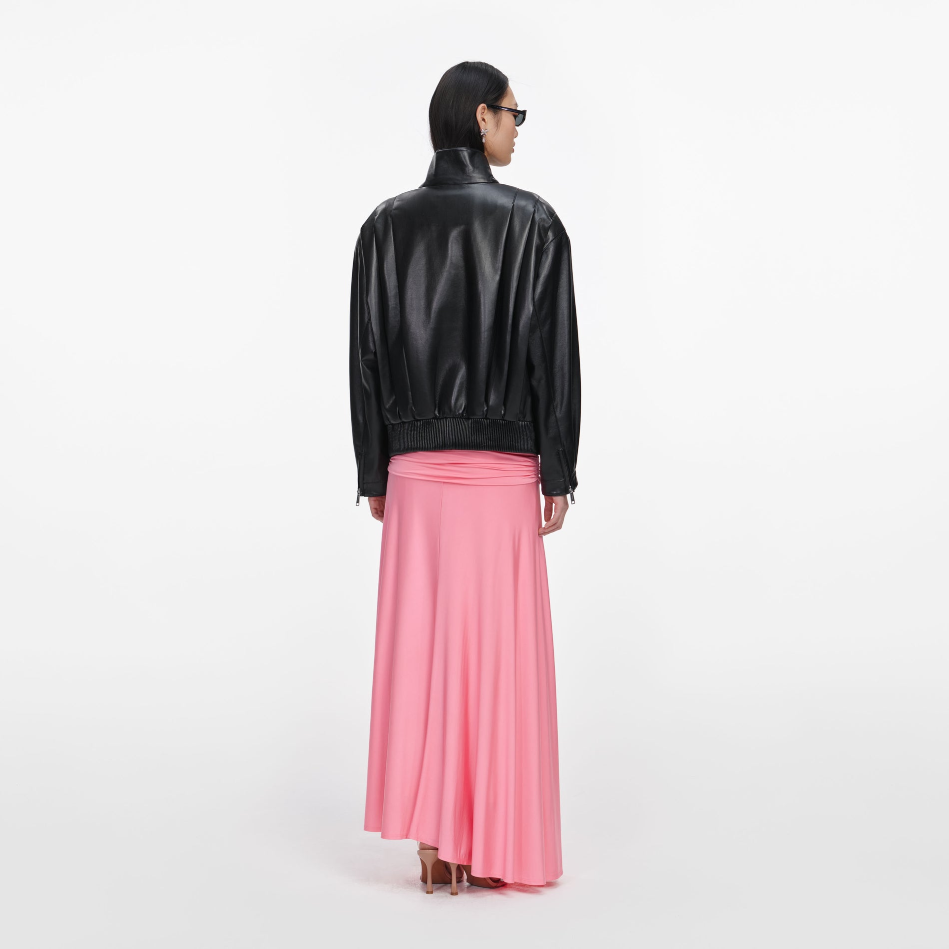 Back view of a woman wearing the Black Faux Leather Biker Jacket