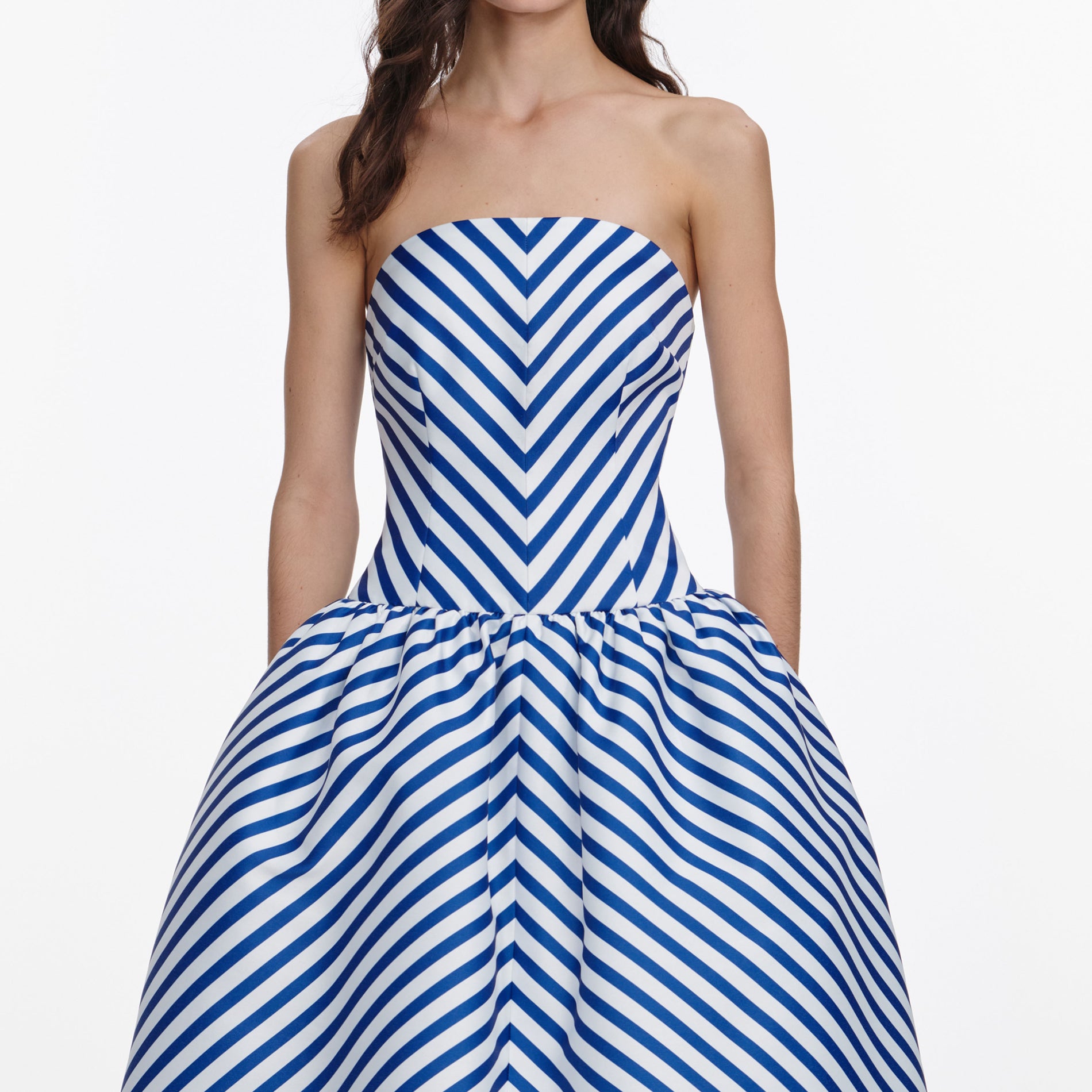 A close up of a woman wearing the Navy Stripe Taffeta Midi Dress