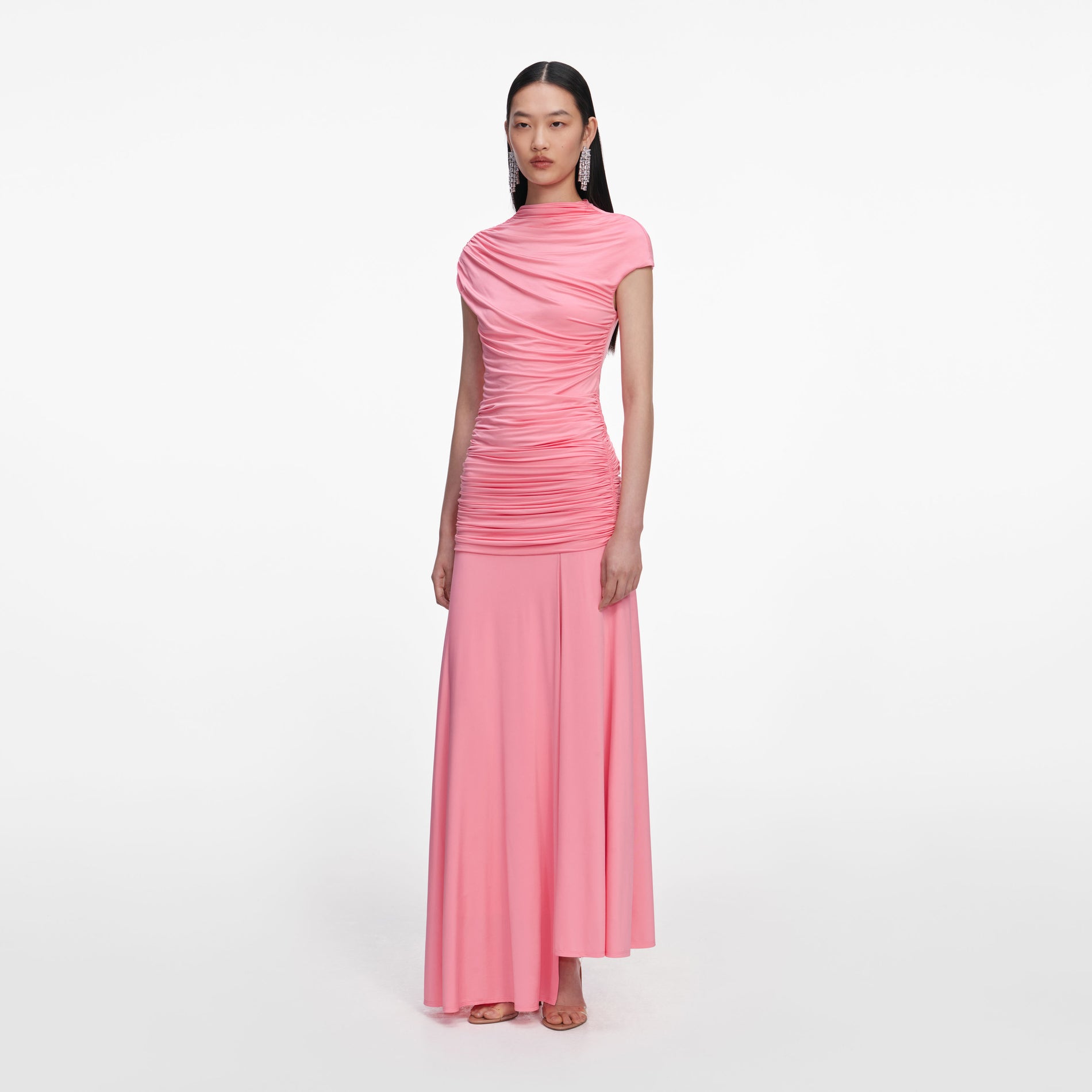 Side view of a woman wearing the Pink Jersey Gathered Maxi Skirt