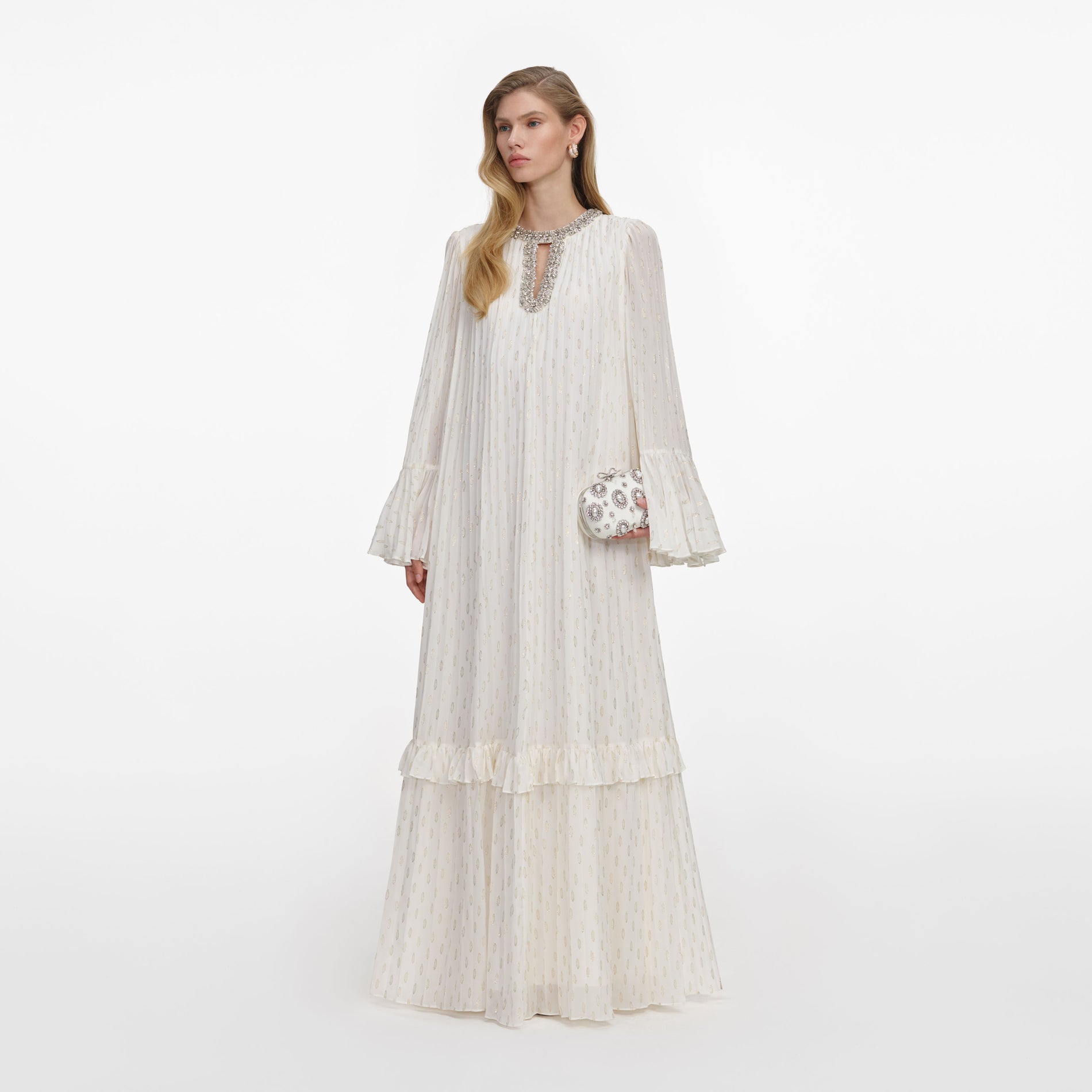 Side view of a woman wearing the Cream And Gold Chiffon Maxi Dress