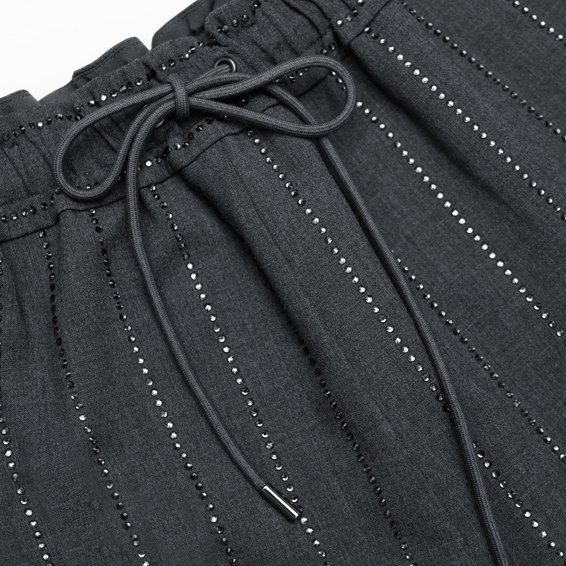 A close up of the fabric for the Grey Rhinestone Pinstripe Trousers