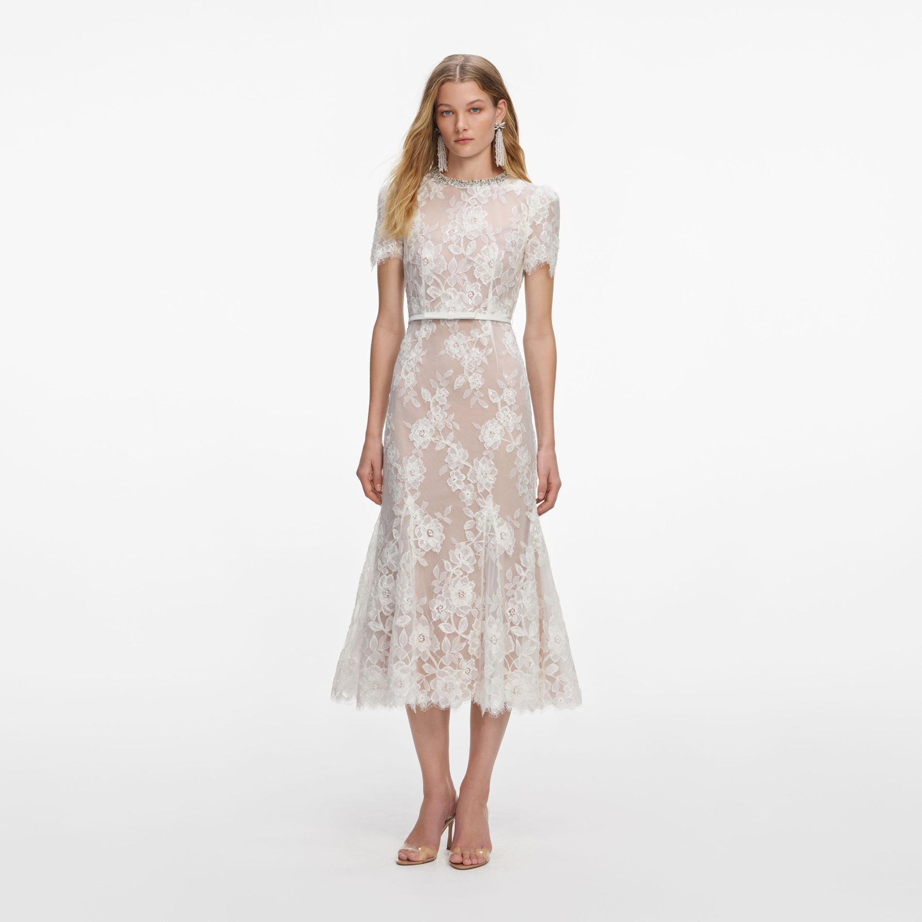Front view of a woman wearing the White Sequin Lace Midi Dress