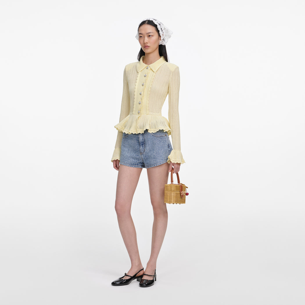 Side view of a woman wearing the Rhinestone Croc Effect Denim Shorts