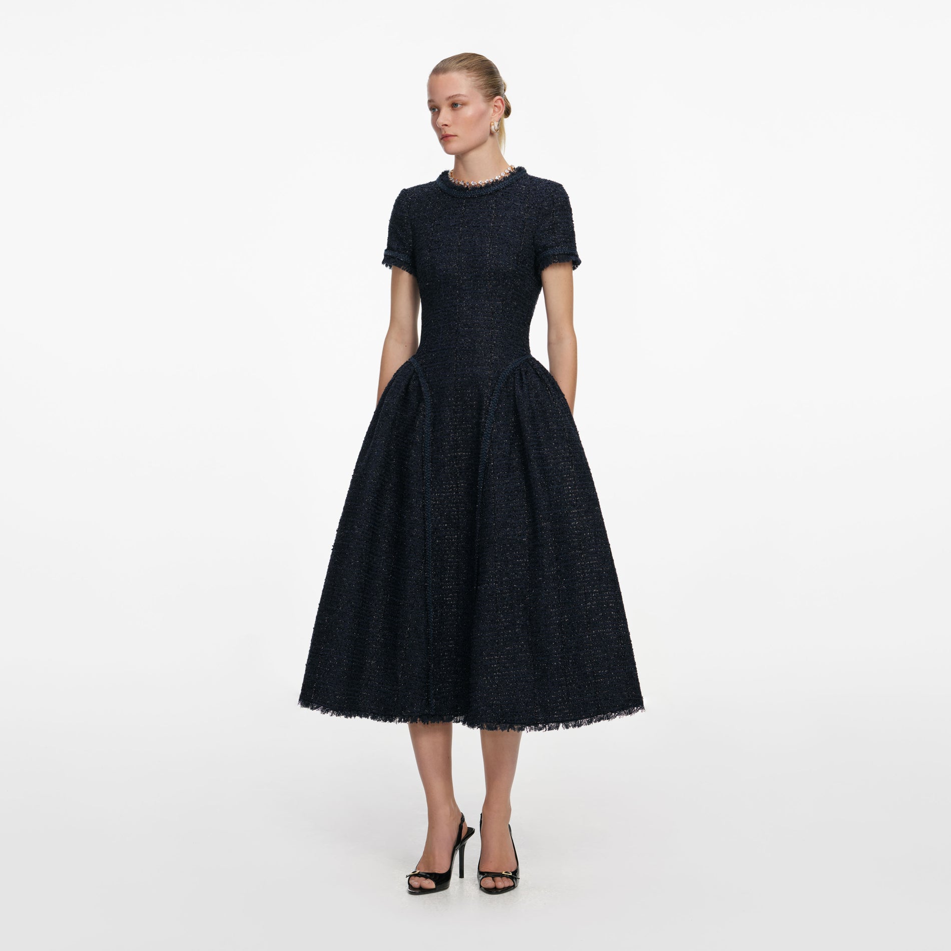 Side view of a woman wearing the Navy Metallic Boucle Midi Dress