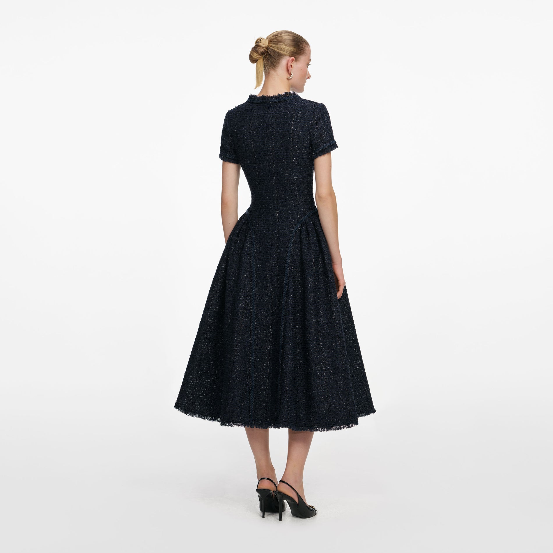Back view of a woman wearing the Navy Metallic Boucle Midi Dress