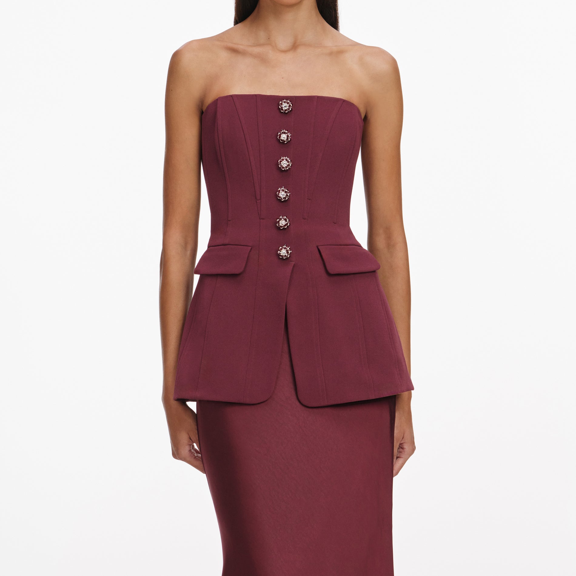 A close up of a woman wearing the Burgundy Bandeau Maxi Dress