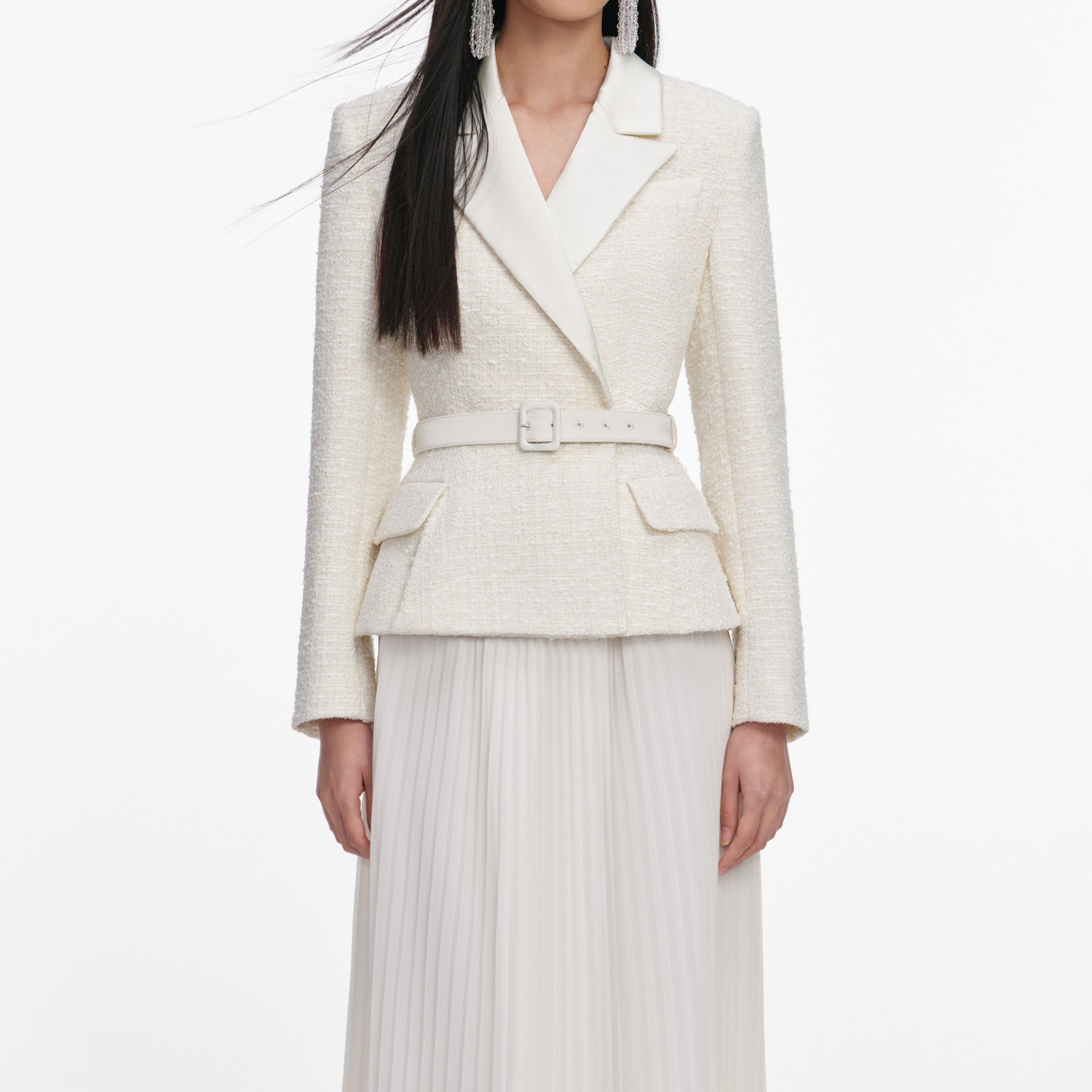 A close up of a woman wearing the Cream Tailored Boucle Chiffon Maxi Dress