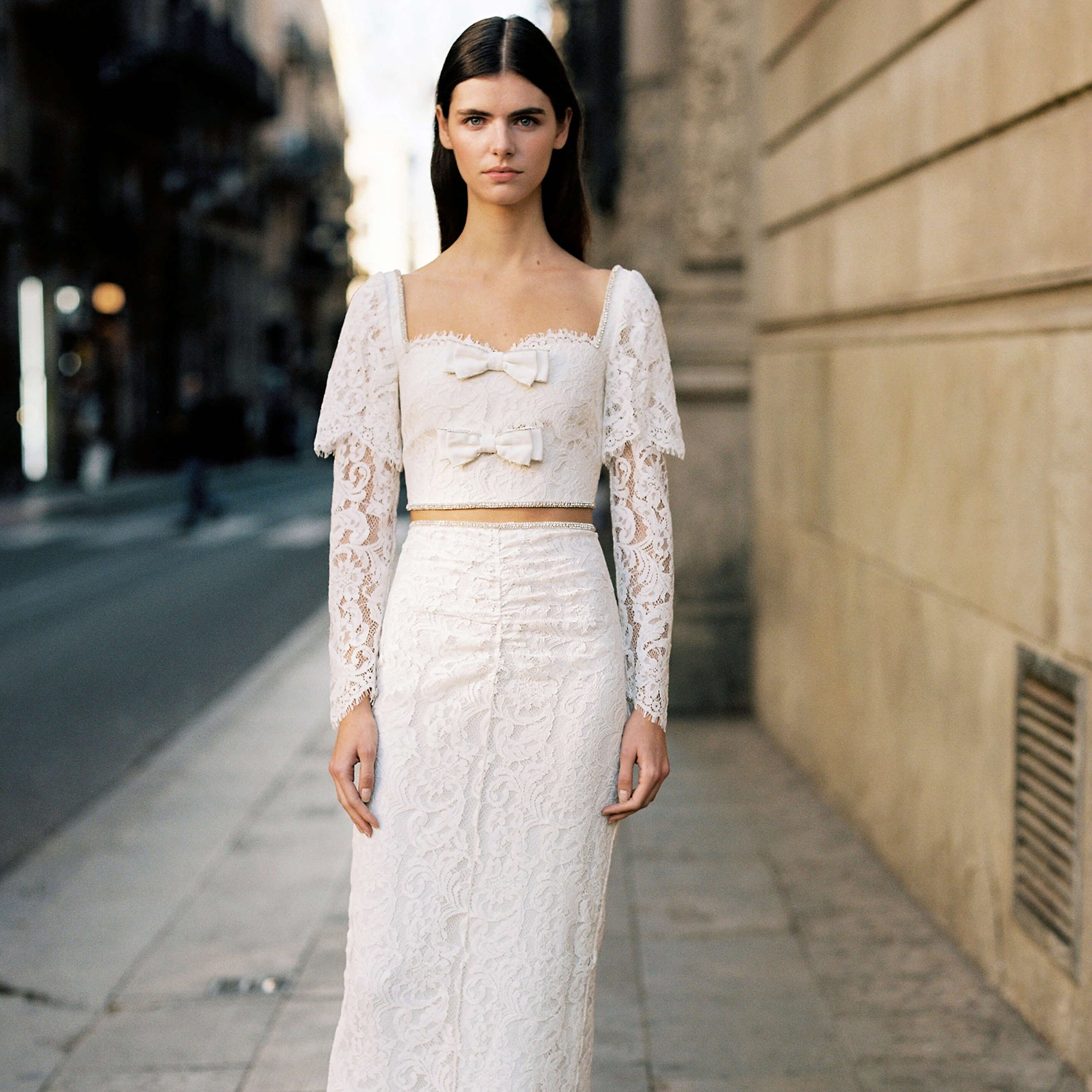 A woman wearing the Cream Cord Lace Midi Skirt