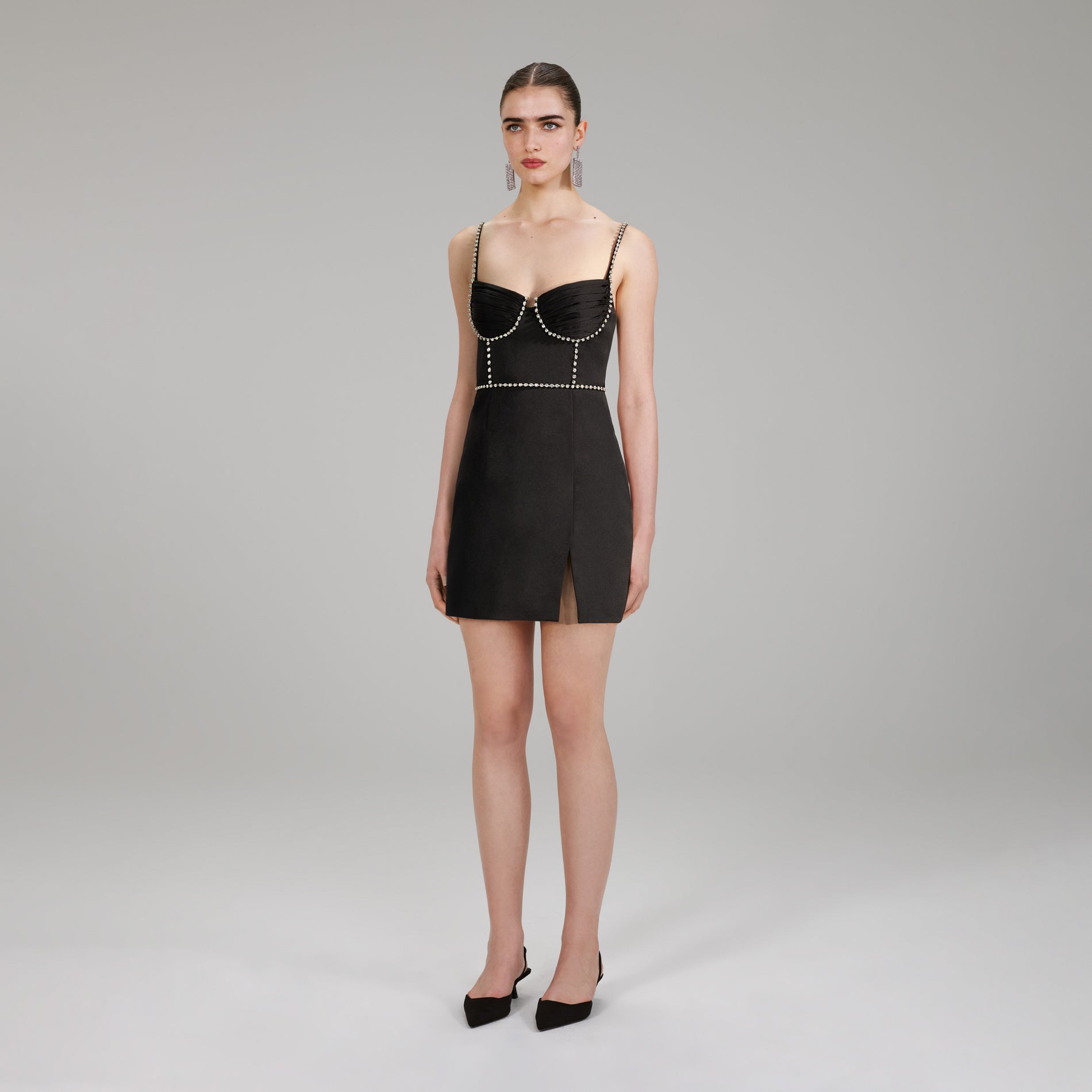 A woman wearing the Bonded Satin Mini Dress