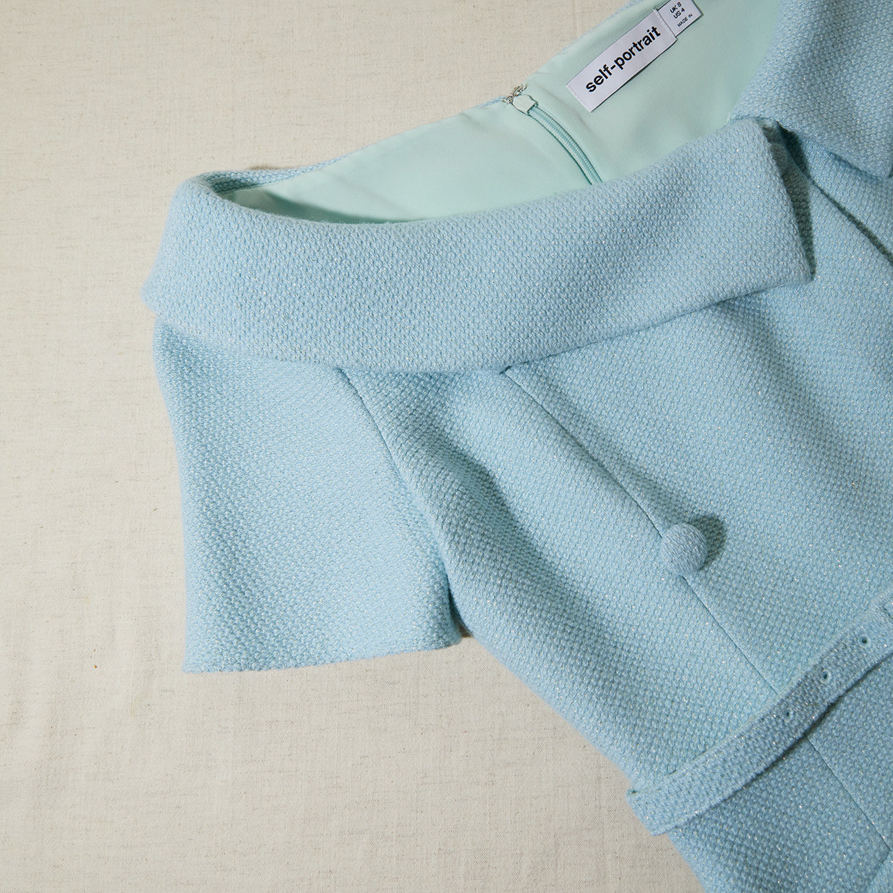 A close up of the fabric for the Blue Textured Woven Midi Dress