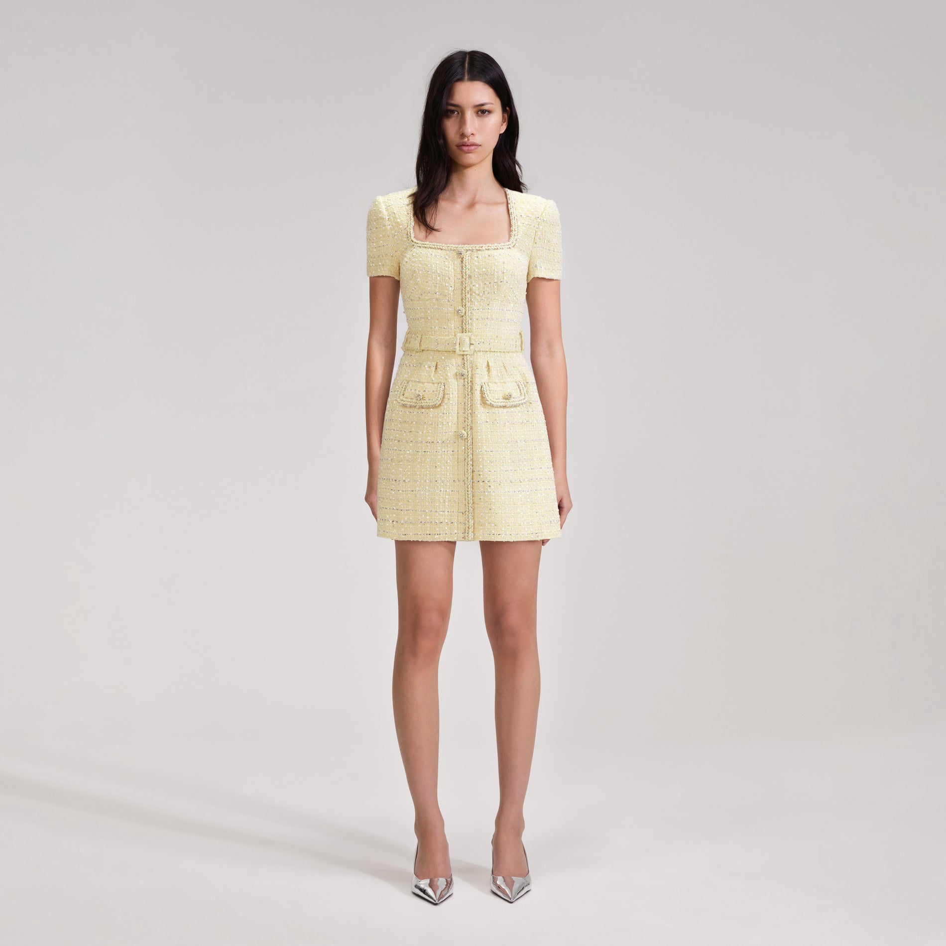 A woman wearing the Yellow Boucle Mini Dress