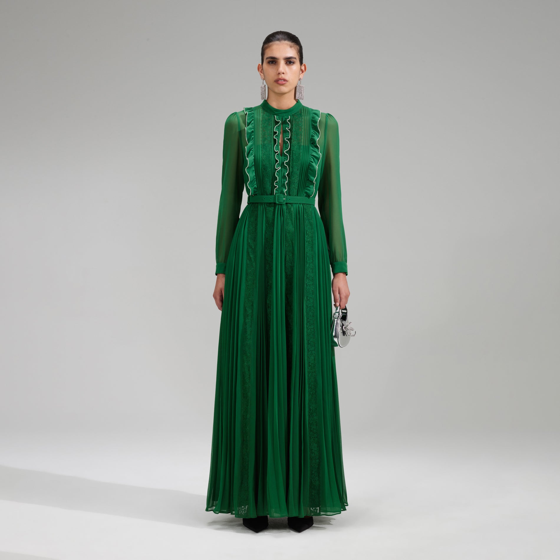A woman wearing the Green Pleated Rhinestone Detail Maxi Dress