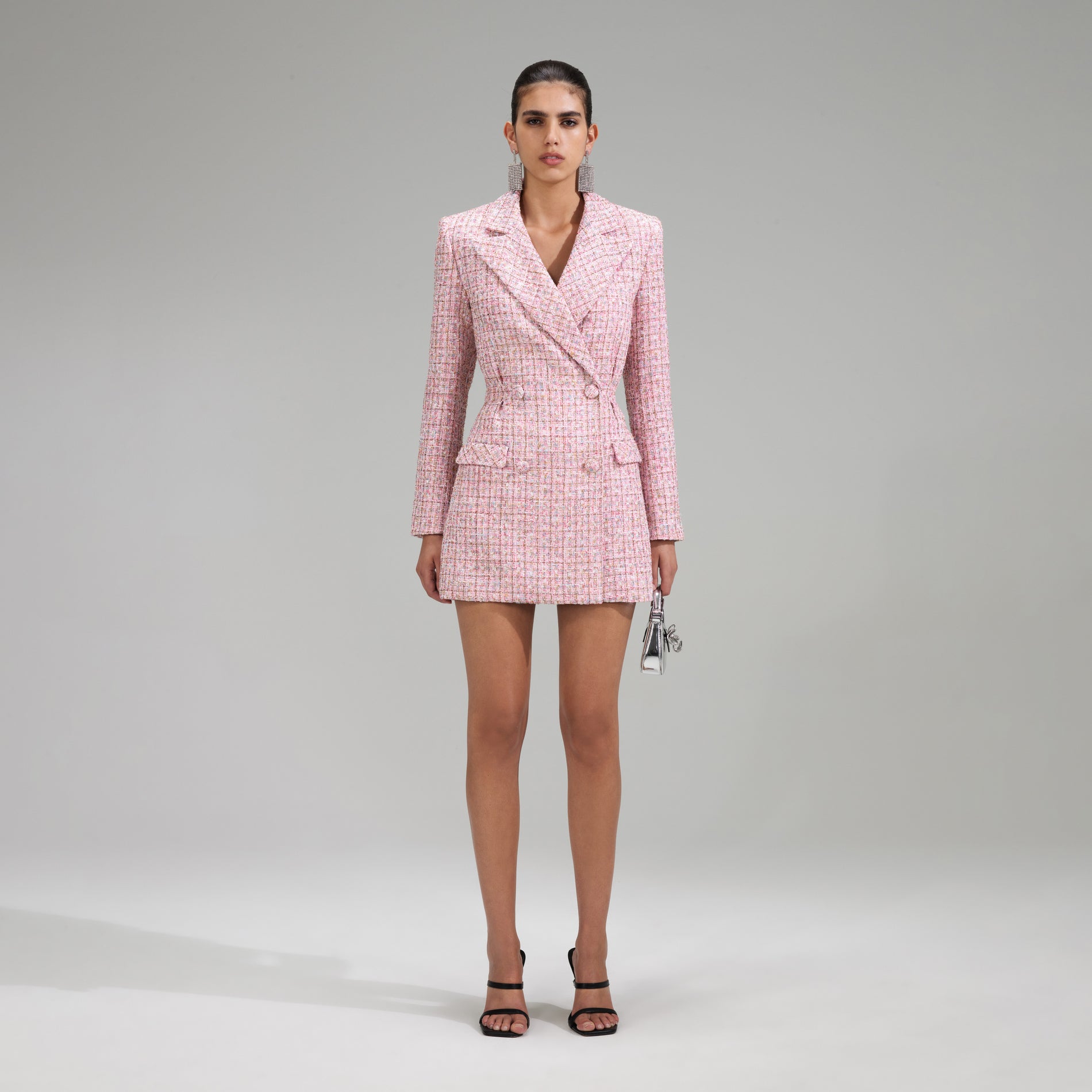 A woman wearing the Pink V Neck Boucle Tailored Mini Dress