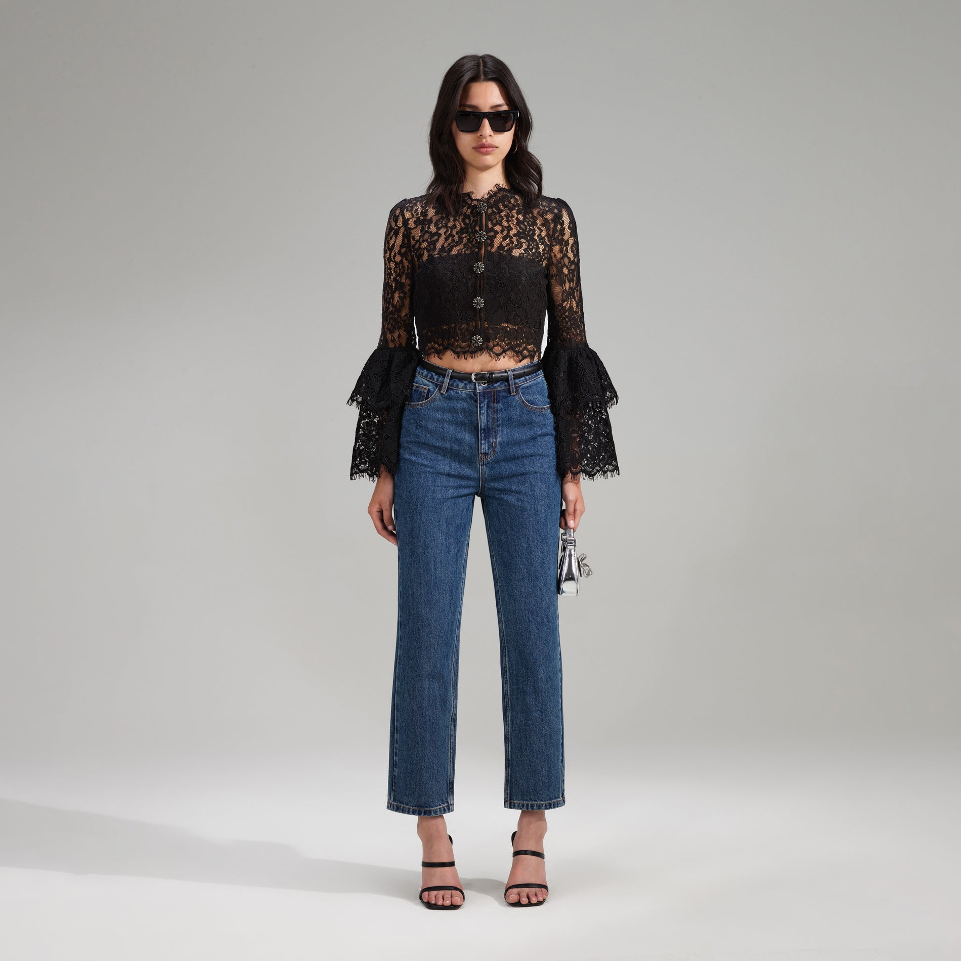 A woman wearing the Black Cord Lace Top