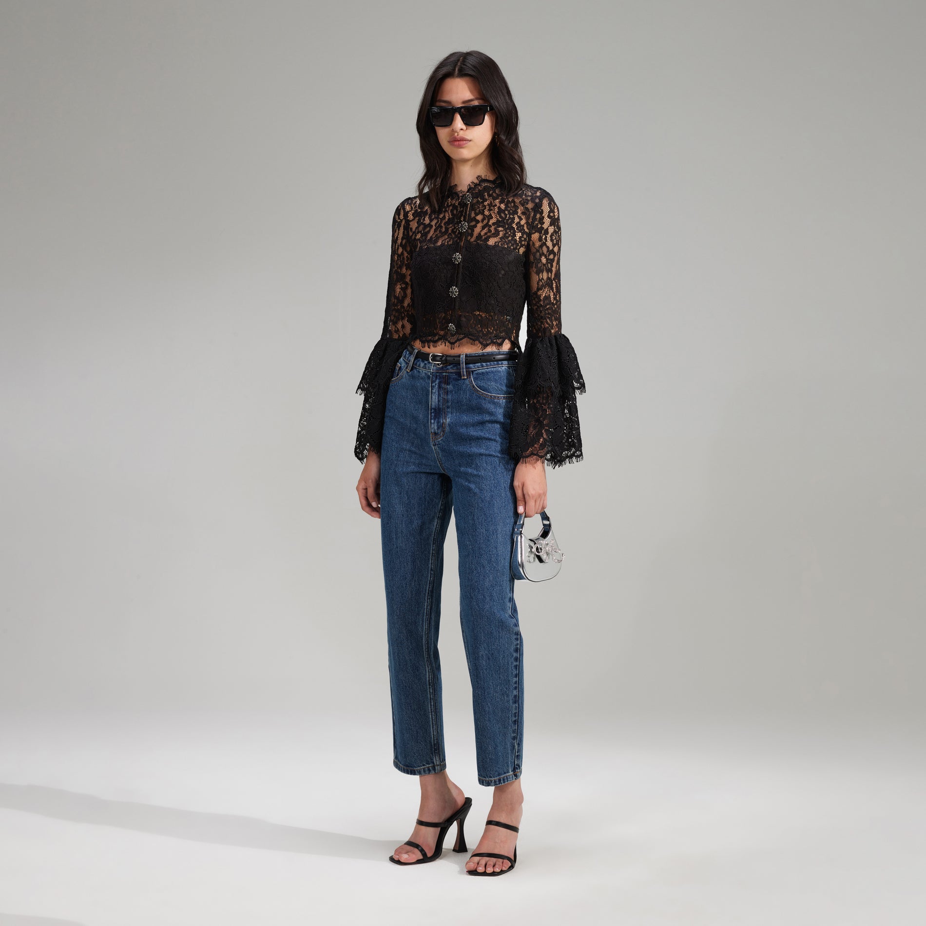 A woman wearing the Black Cord Lace Top