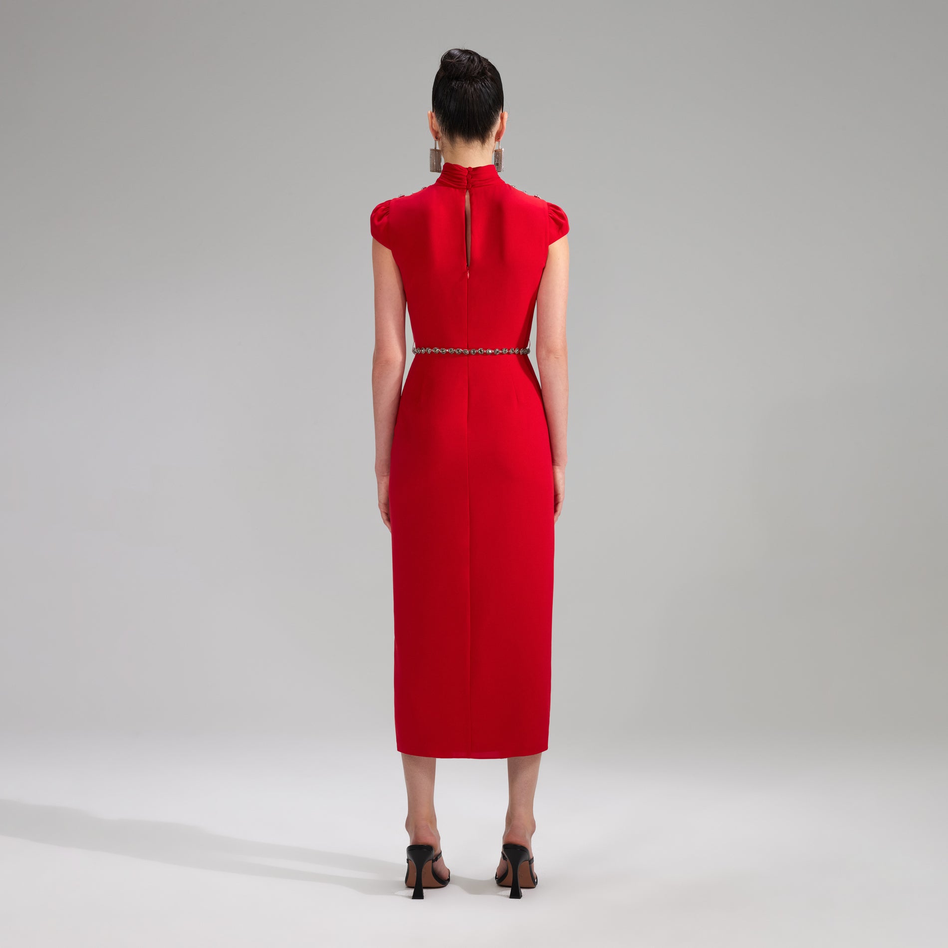 A woman wearing the Red Stretch Crepe Ruched Midi Dress