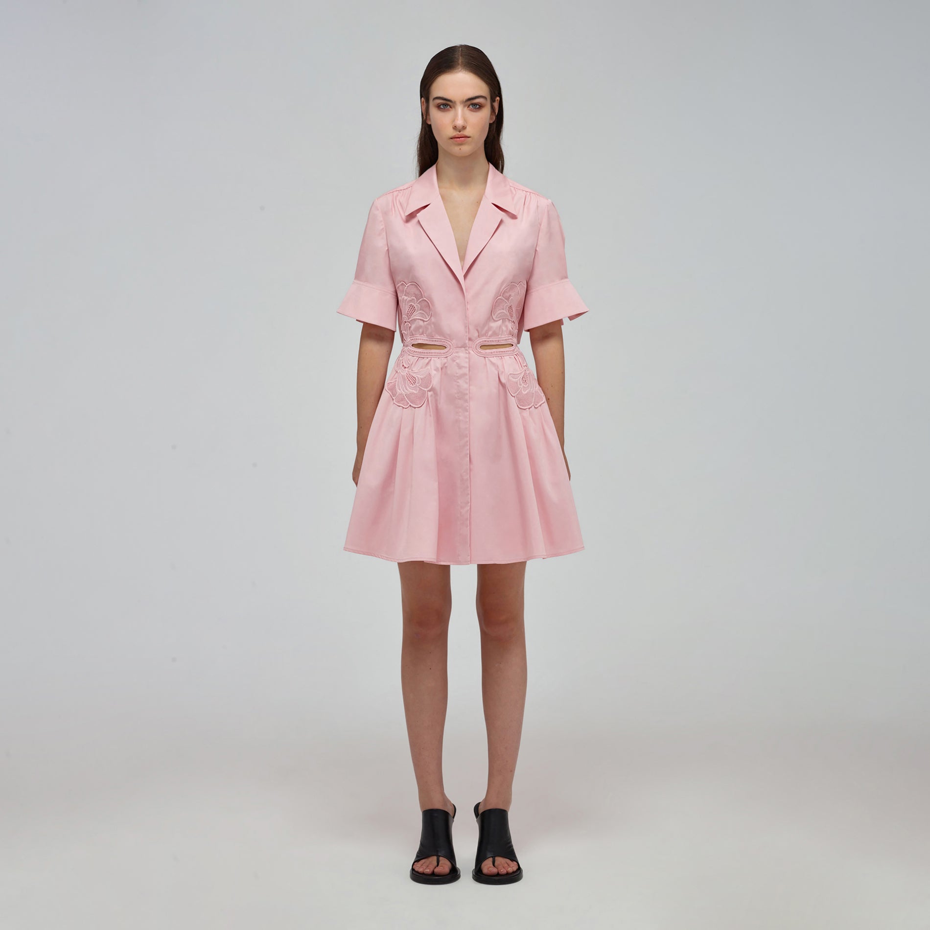 A woman wearing the Pink Organic Cotton Cut Out Mini Dress