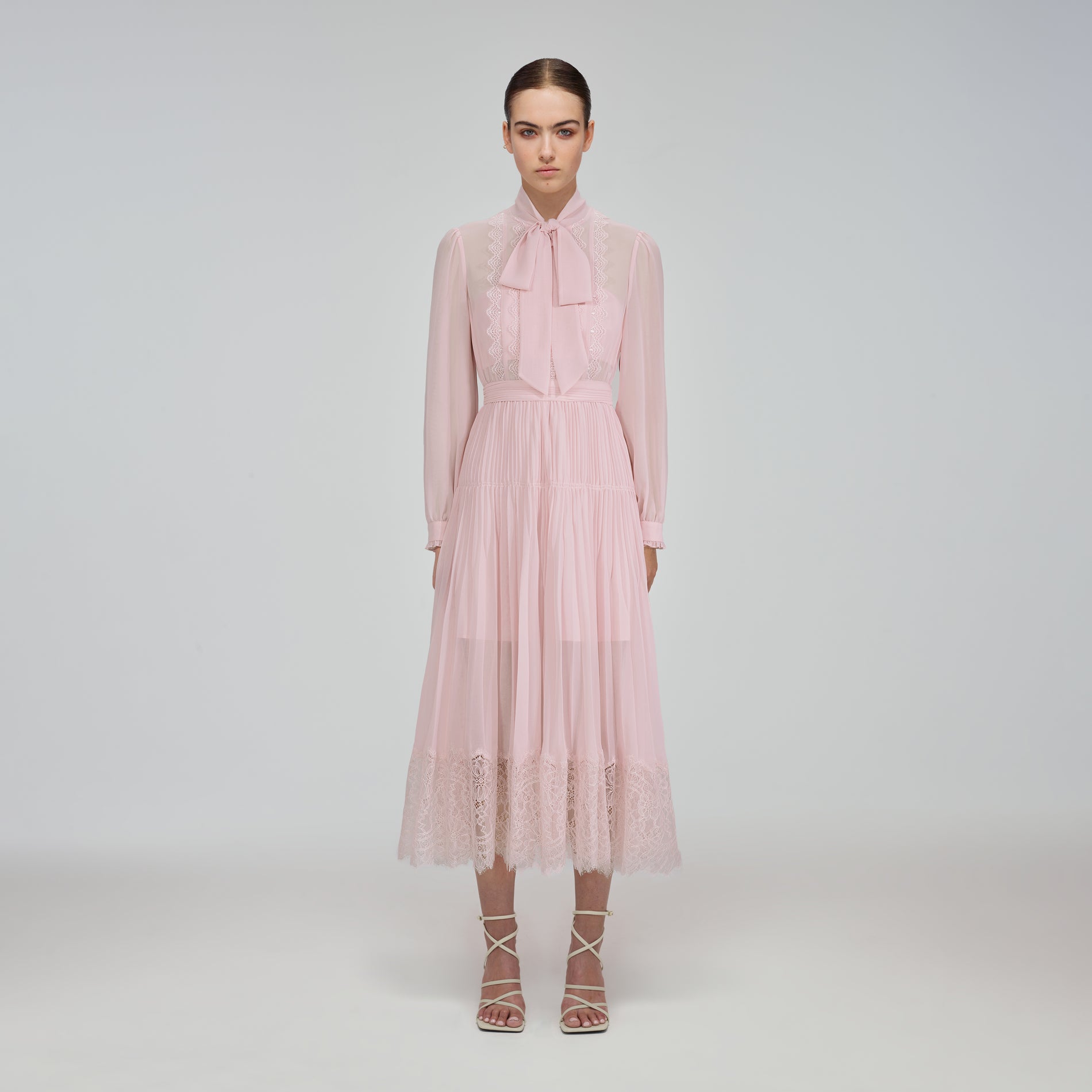A woman wearing the Pale Pink Chiffon Trimmed Midi Dress