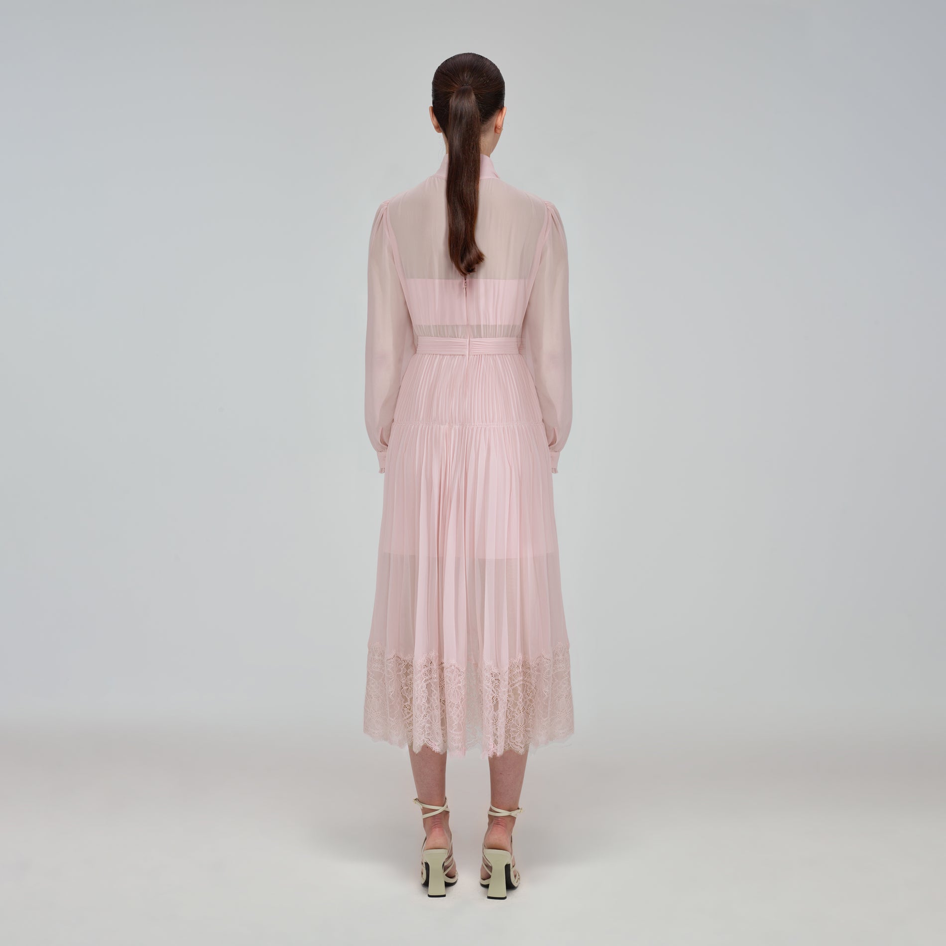 A woman wearing the Pale Pink Chiffon Trimmed Midi Dress