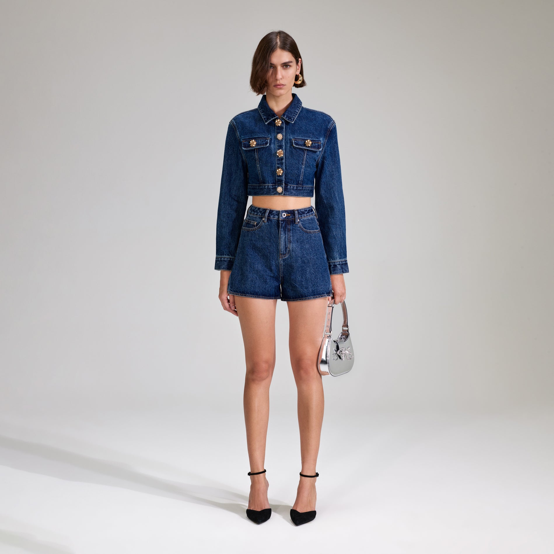 A woman wearing the Denim Jacket With Buttons