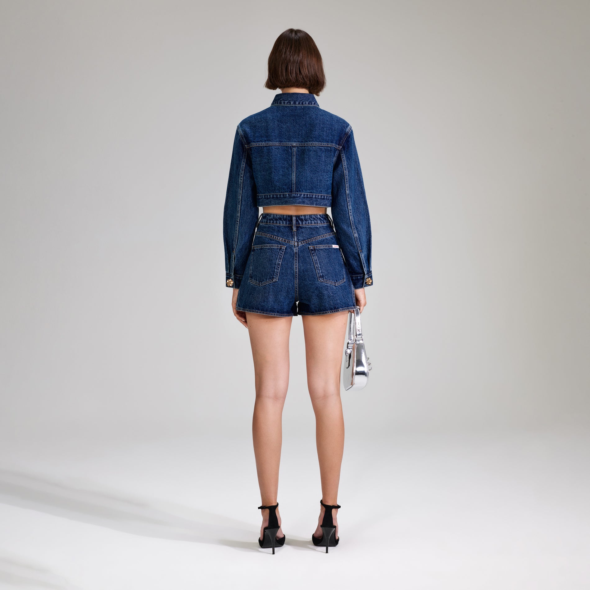 A woman wearing the Denim Jacket With Buttons