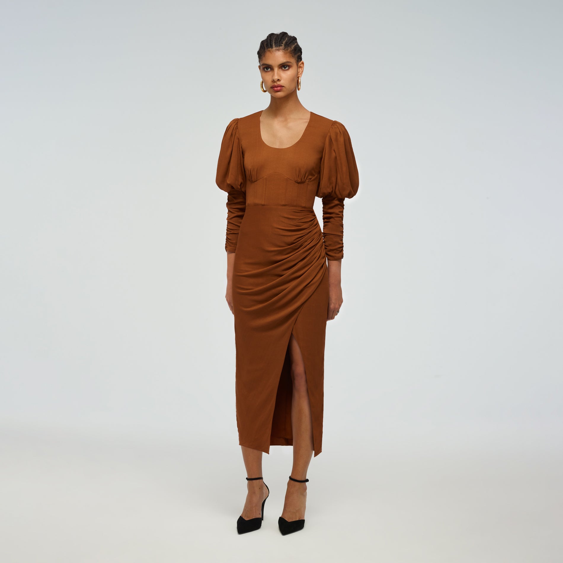 A woman wearing the Puff Sleeve Midi Dress